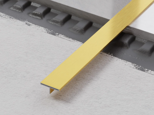 Profil décoratif Ts en acier inoxydable doré satiné pour couvrir les joints rectifiés