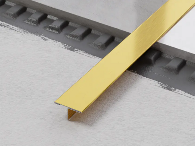 Profil décoratif en T avec couvercle de jonction en acier inoxydable satiné doré