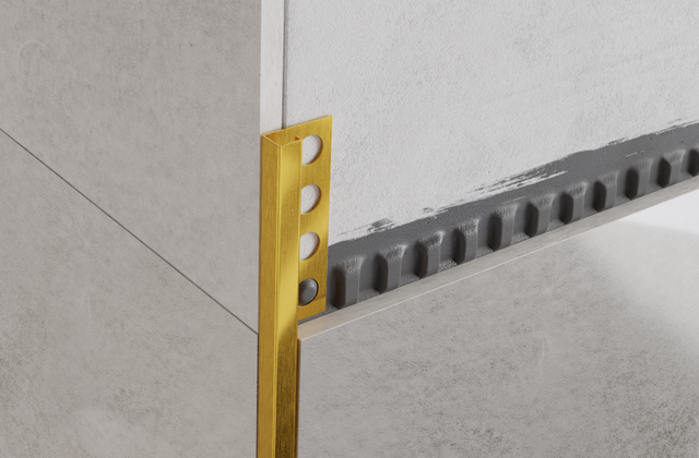 Decorative corner profile P in satin gold stainless steel