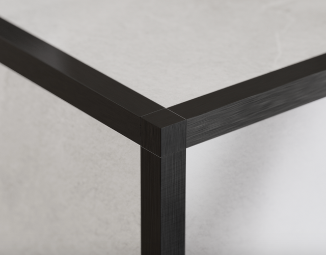 Corner finish for satin black QS ground stainless steel profiles
